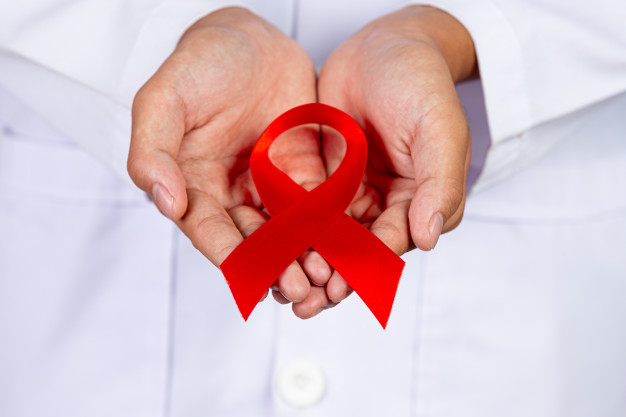 doctor holds red ribbon hiv awareness awareness world aids day world sexual health day 1150 24410 香港保险业联会推出标准核保问卷 大部分已存疾病披露期以5年为限